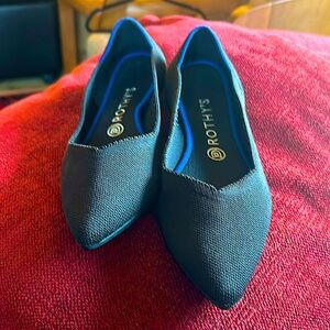 Rothy’s Point - Black w/Blue accent used condition with signs of light wear.